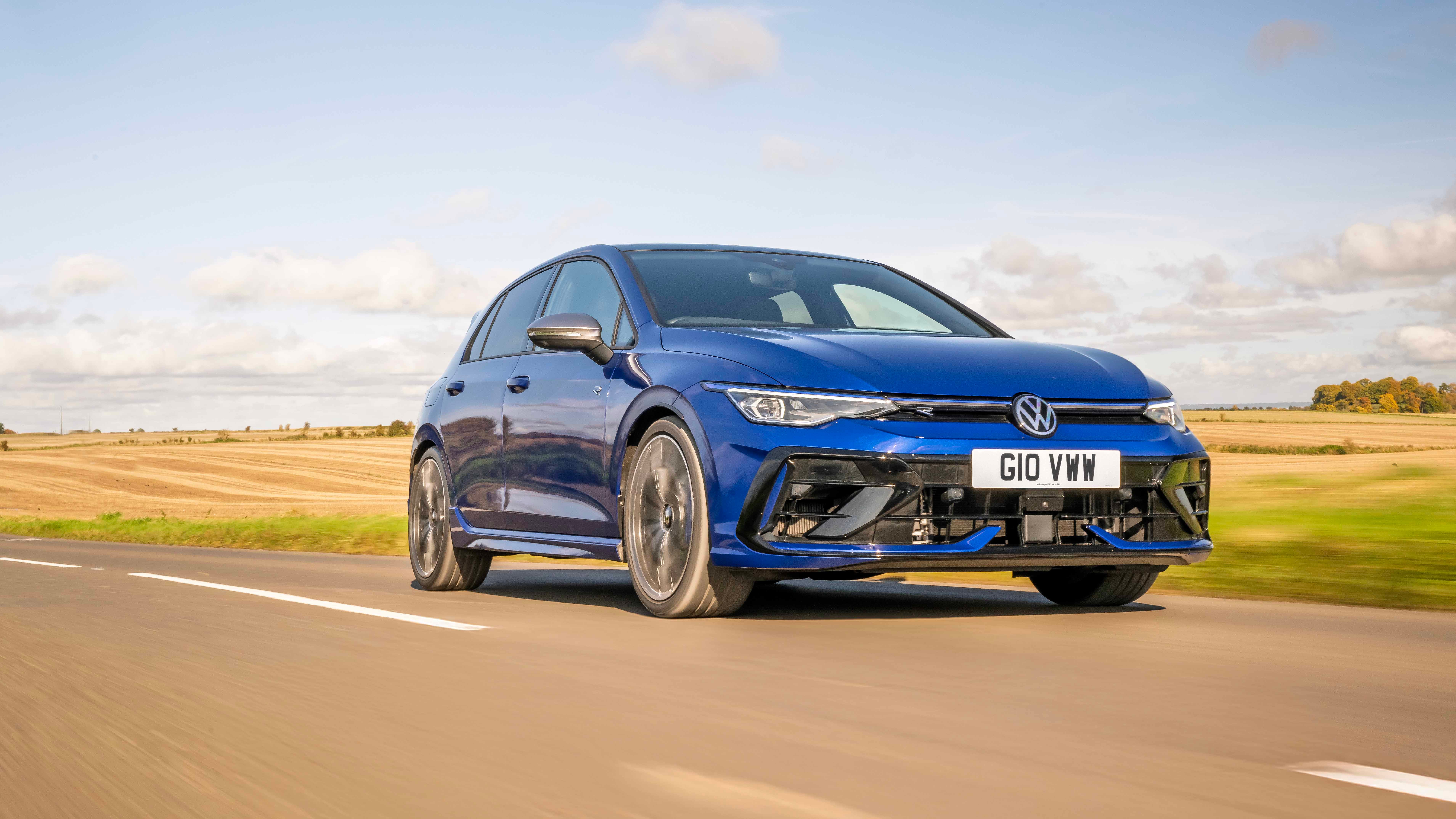 VW Golf R driving, low, blue