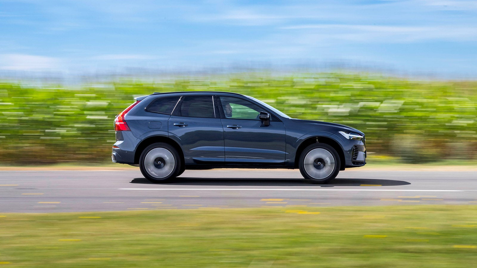 Volvo XC60 in blue, side driving