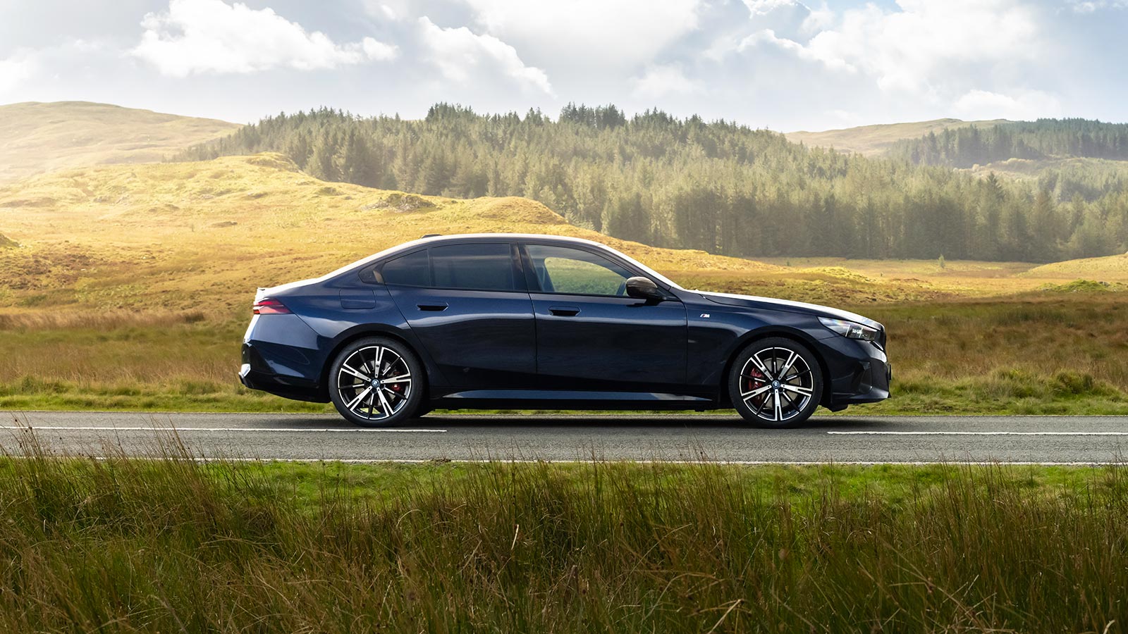 BMW 5 Series in blue, side static