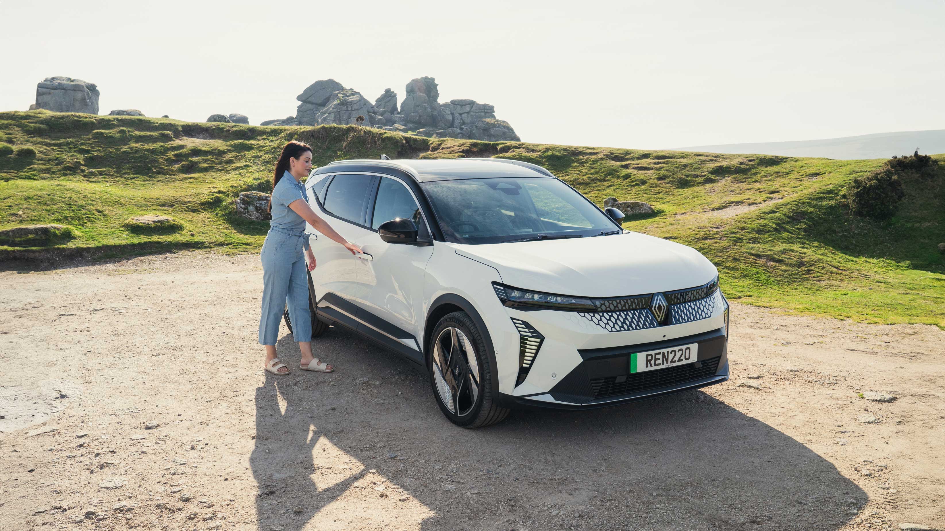 Lady walking up to Renault Scenic E-Tech